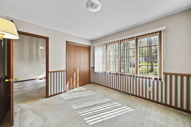 216 Wickenham Dr, Spring Arbor, MI 49283 - carpeted empty room with healthy amount of natural light and baseboards