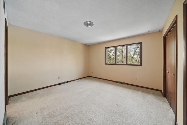 216 Wickenham Dr, Spring Arbor, MI 49283 - unfurnished bedroom with light colored carpet and baseboards
