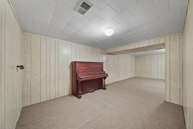 216 Wickenham Dr, Spring Arbor, MI 49283 - finished below grade area with carpet floors and wooden walls
