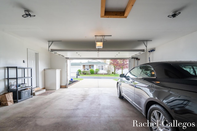 garage featuring a garage door opener