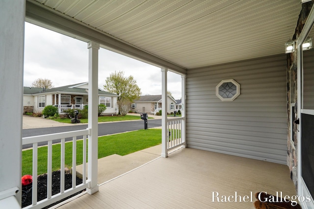 unfurnished sunroom featuring a residential view
