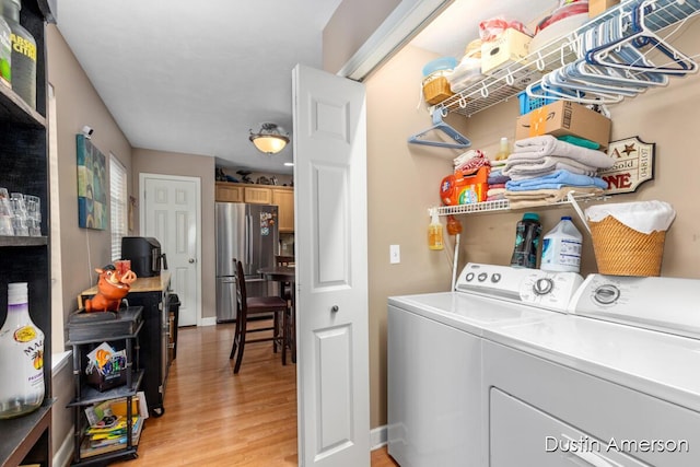 8485 E Center Park Dr SW Unit 18, Byron Center, MI 49315 - laundry room featuring washer and dryer and light wood-style flooring