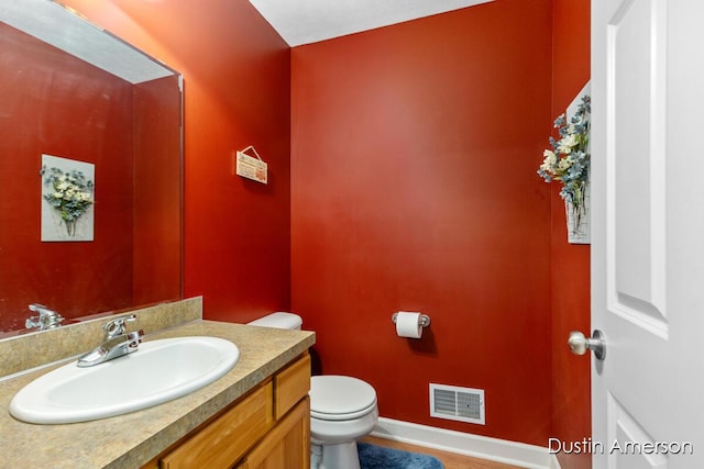 8485 E Center Park Dr SW Unit 18, Byron Center, MI 49315 - bathroom with toilet, baseboards, and vanity