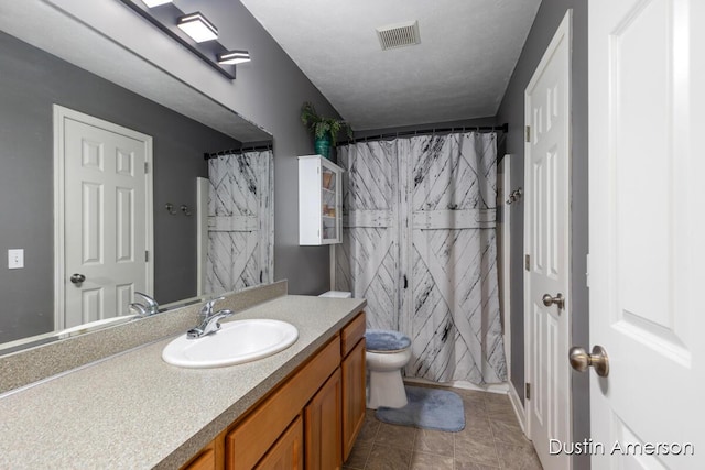 8485 E Center Park Dr SW Unit 18, Byron Center, MI 49315 - full bathroom with vanity, toilet, curtained shower, and tile patterned floors