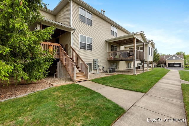 8485 E Center Park Dr SW Unit 18, Byron Center, MI 49315 - back of house featuring a yard, central AC unit, stairs, and a deck