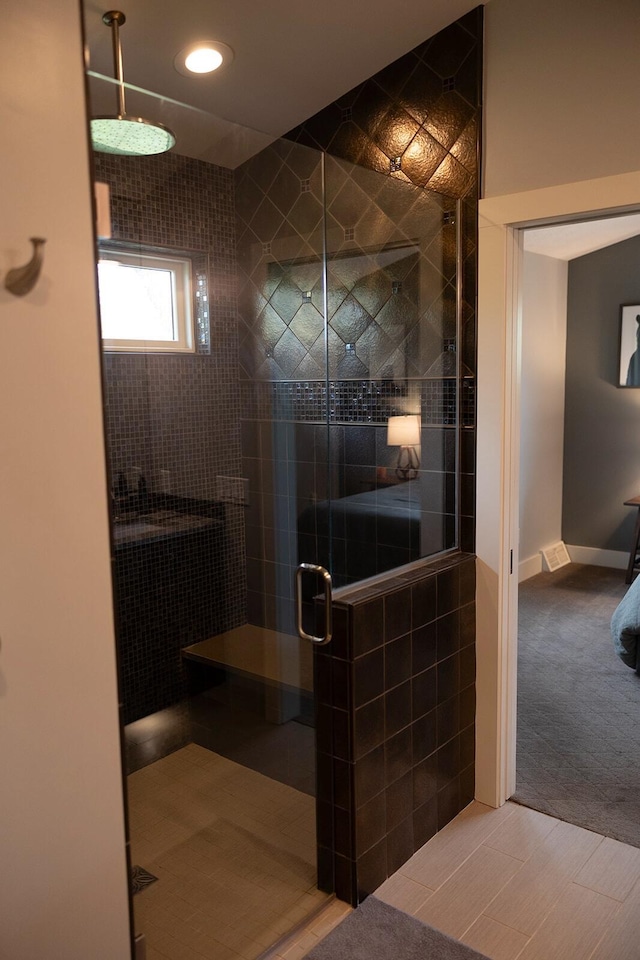 full bathroom with a stall shower and recessed lighting