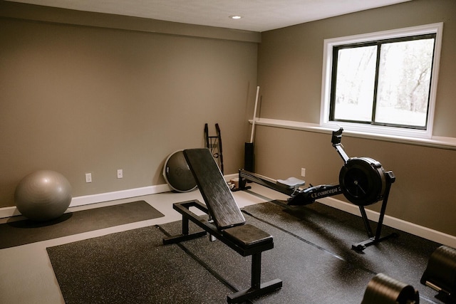 workout room featuring baseboards and recessed lighting