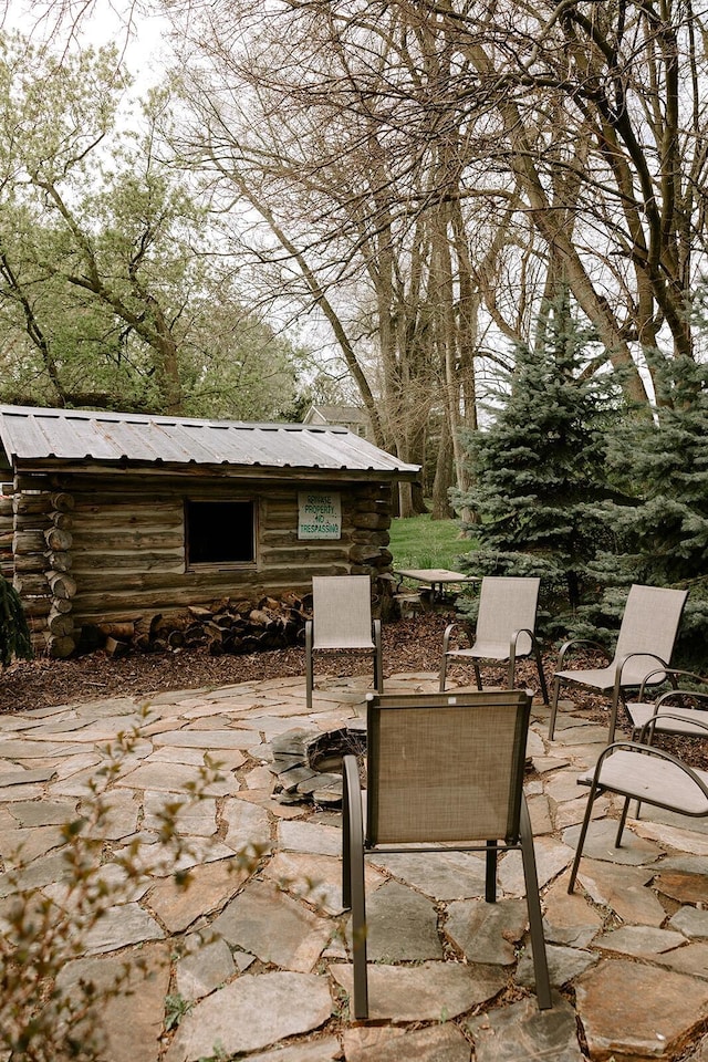 view of patio featuring an outdoor structure