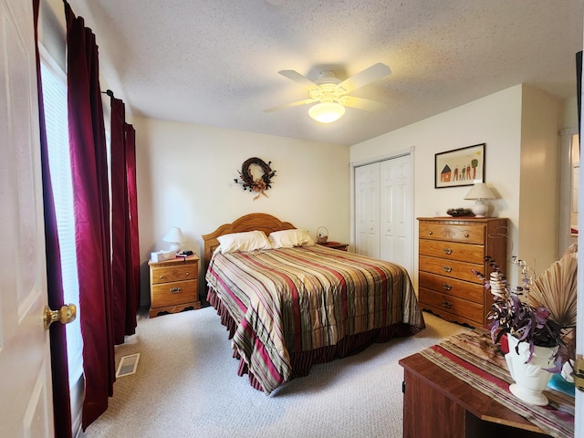 3034 Royalton Heights Rd, Saint Joseph, MI 49085 - bedroom featuring light carpet, a closet, a textured ceiling, and ceiling fan