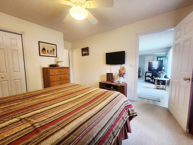 3034 Royalton Heights Rd, Saint Joseph, MI 49085 - bedroom with light colored carpet, a closet, and ceiling fan