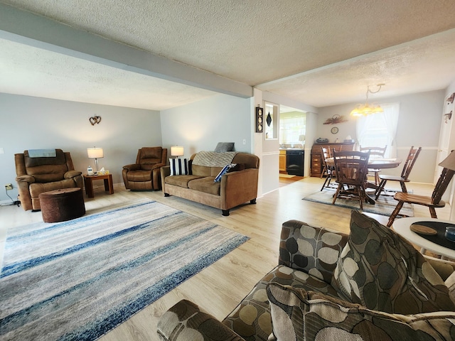 3034 Royalton Heights Rd, Saint Joseph, MI 49085 - living room featuring wood finished floors, a textured ceiling, and baseboards