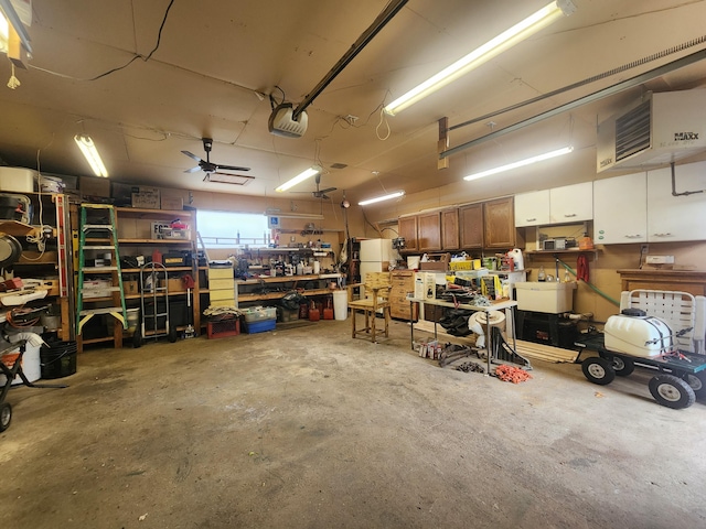 3034 Royalton Heights Rd, Saint Joseph, MI 49085 - garage with a workshop area and a garage door opener