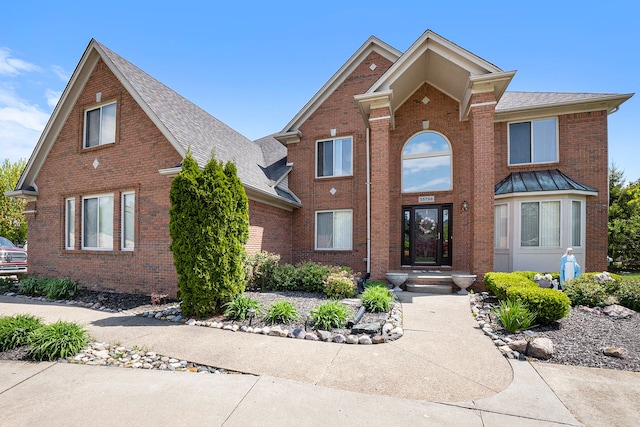 55796 Caesars Dr, Shelby Twp, MI 48315 - traditional home featuring brick siding and a shingled roof