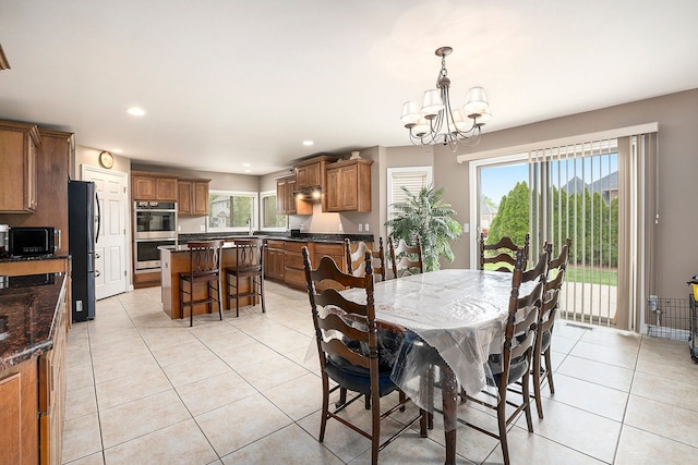 55796 Caesars Dr, Shelby Twp, MI 48315 - dining room featuring a chandelier, light tile patterned floors, plenty of natural light, and recessed lighting