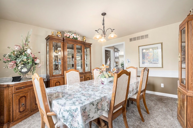 55796 Caesars Dr, Shelby Twp, MI 48315 - dining room featuring light carpet and a chandelier