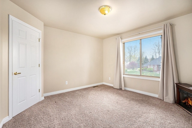 55796 Caesars Dr, Shelby Twp, MI 48315 - spare room with carpet and baseboards