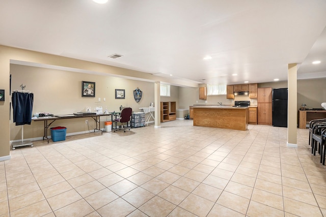 55796 Caesars Dr, Shelby Twp, MI 48315 - kitchen featuring freestanding refrigerator, under cabinet range hood, open floor plan, light tile patterned floors, and recessed lighting