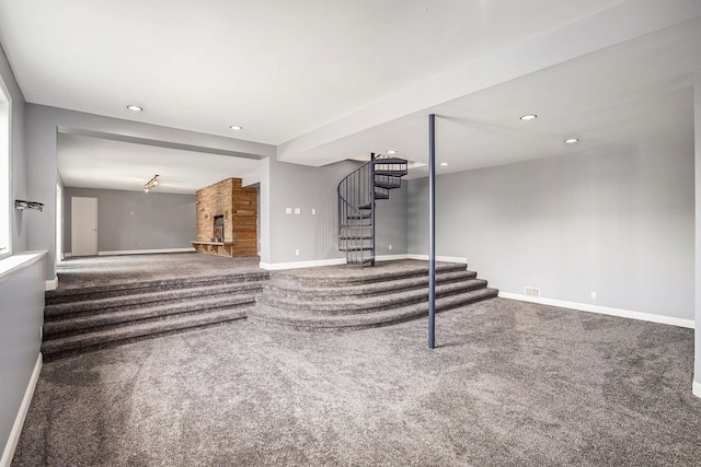 8411 Jordan Rd, Grand Blanc, MI 48439 - unfurnished living room with carpet flooring, stairway, baseboards, recessed lighting, and a fireplace
