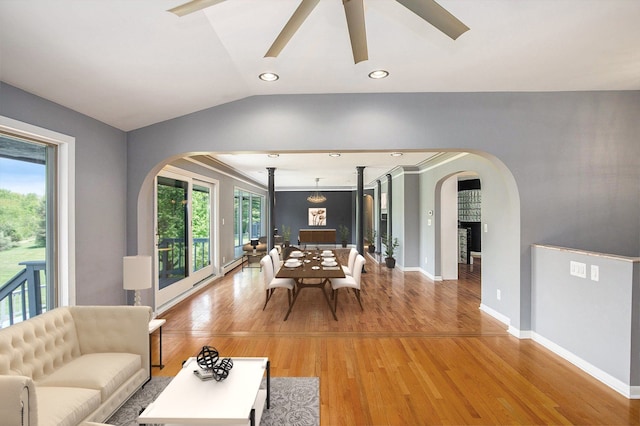8411 Jordan Rd, Grand Blanc, MI 48439 - living room featuring arched walkways, light wood-style flooring, ceiling fan, baseboards, and lofted ceiling