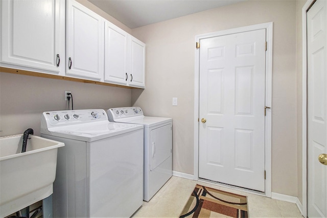 860 Woodhaven Dr, Commerce Twp, MI 48390 - laundry area with independent washer and dryer, cabinet space, and baseboards
