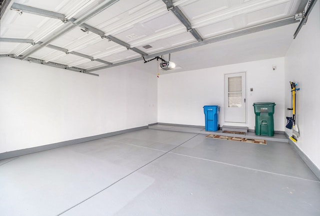 860 Woodhaven Dr, Commerce Twp, MI 48390 - garage with baseboards and a garage door opener