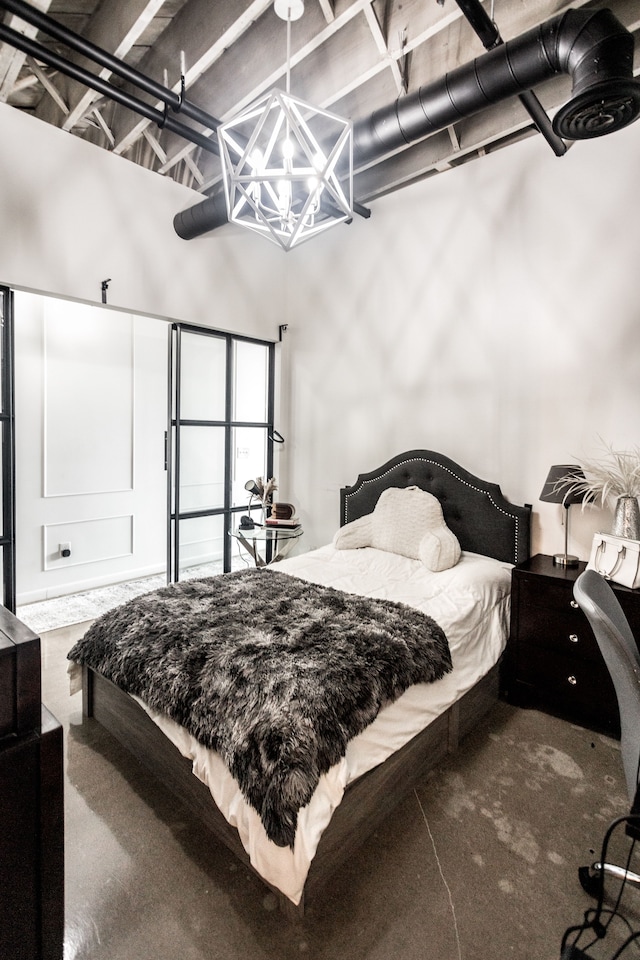 2987 Franklin St Unit 5-2D, Detroit, MI 48207 - bedroom featuring a chandelier