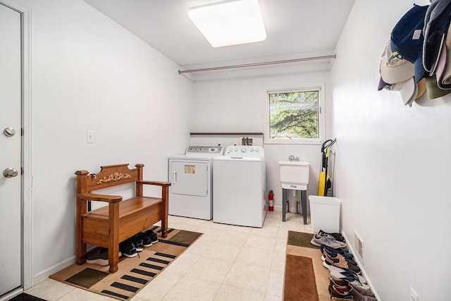 454 Breconshire Dr, Saline, MI 48176 - washroom with independent washer and dryer and light tile patterned flooring