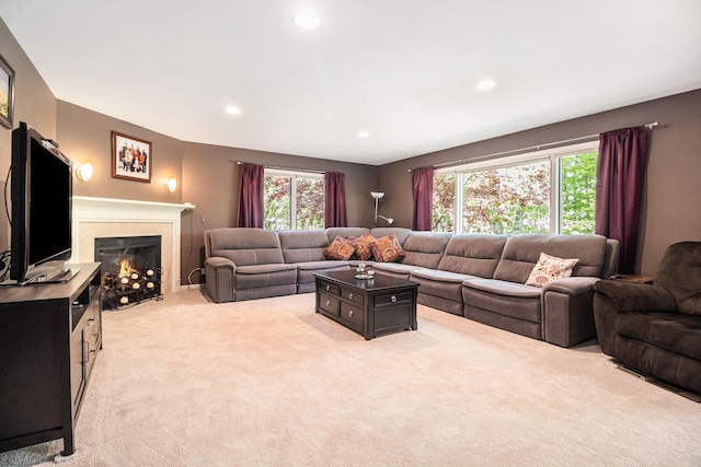 454 Breconshire Dr, Saline, MI 48176 - living room with light carpet, recessed lighting, and a tiled fireplace