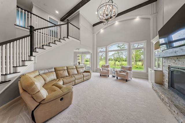 carpeted living room with arched walkways, a towering ceiling, a chandelier, a fireplace, and stairs