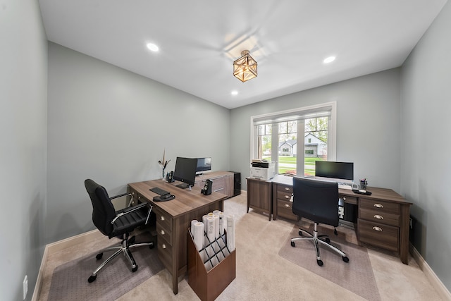 office space with light colored carpet, recessed lighting, and baseboards