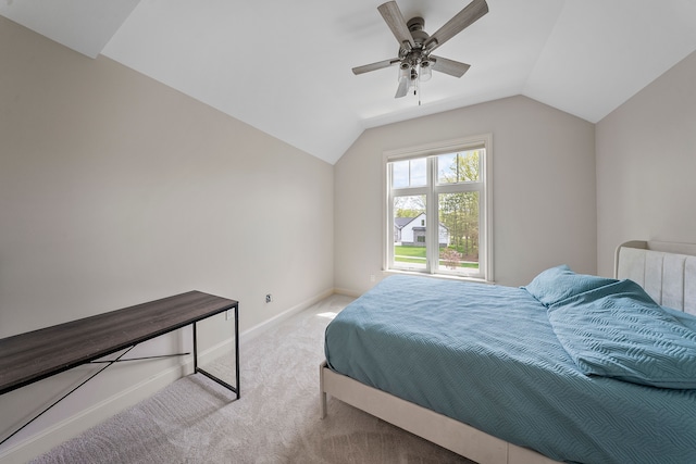 bedroom with carpet, lofted ceiling, baseboards, and ceiling fan