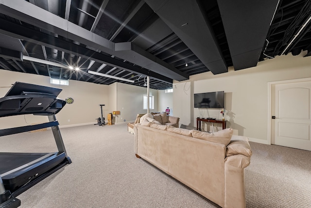 living area with carpet floors, baseboards, and healthy amount of natural light