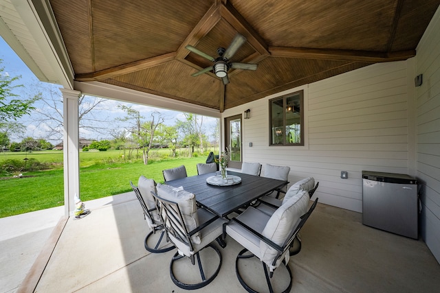 view of patio with a ceiling fan and outdoor dining space