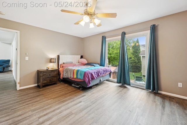 7366 Meadow Ln, Ypsilanti, MI 48197 - bedroom with wood finished floors, baseboards, access to outside, and a ceiling fan