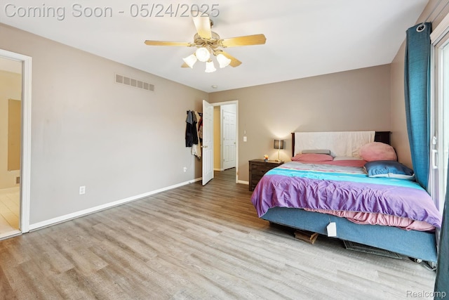 7366 Meadow Ln, Ypsilanti, MI 48197 - bedroom with wood finished floors, baseboards, and a ceiling fan