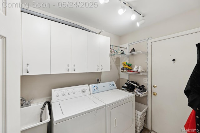 7366 Meadow Ln, Ypsilanti, MI 48197 - washroom featuring cabinet space, independent washer and dryer, and track lighting