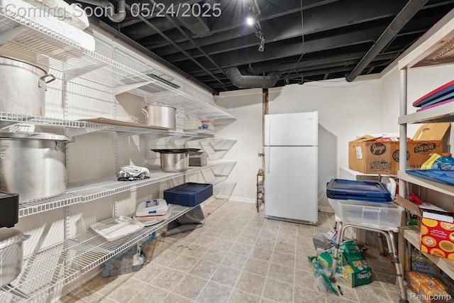 7366 Meadow Ln, Ypsilanti, MI 48197 - finished basement featuring freestanding refrigerator and baseboards