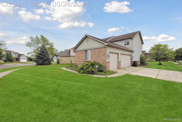 7366 Meadow Ln, Ypsilanti, MI 48197 - view of property exterior with brick siding, a lawn, driveway, and an attached garage