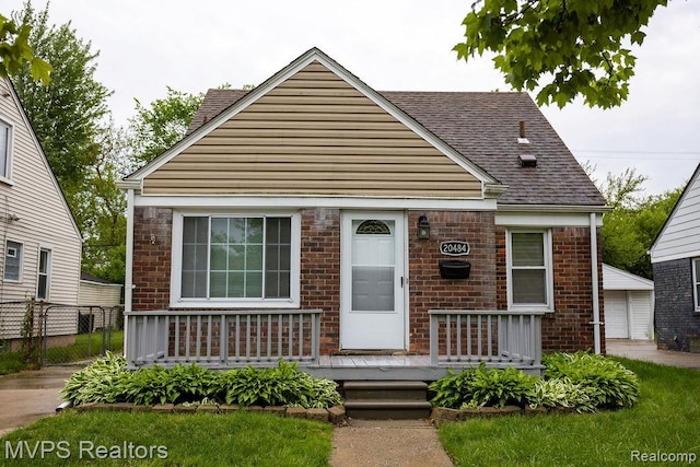 20484 Roscommon St, Harper Woods, MI 48225 - bungalow with roof with shingles and brick siding
