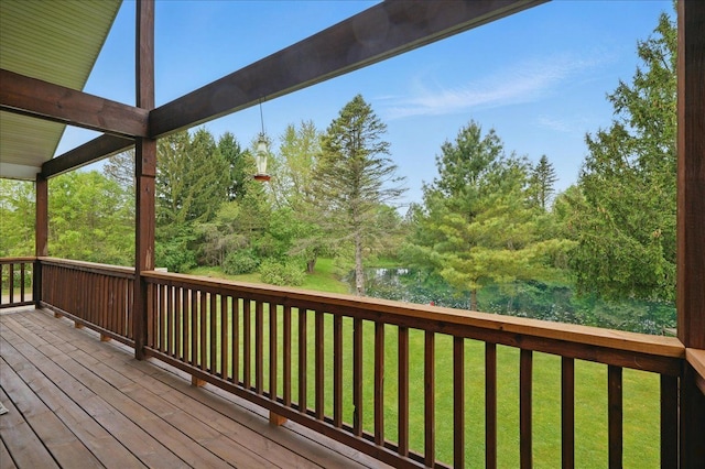 wooden terrace with a yard