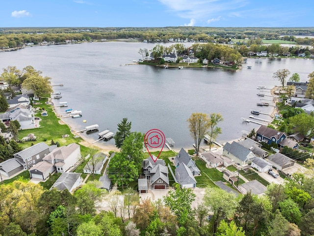 aerial view of residential area with a large body of water