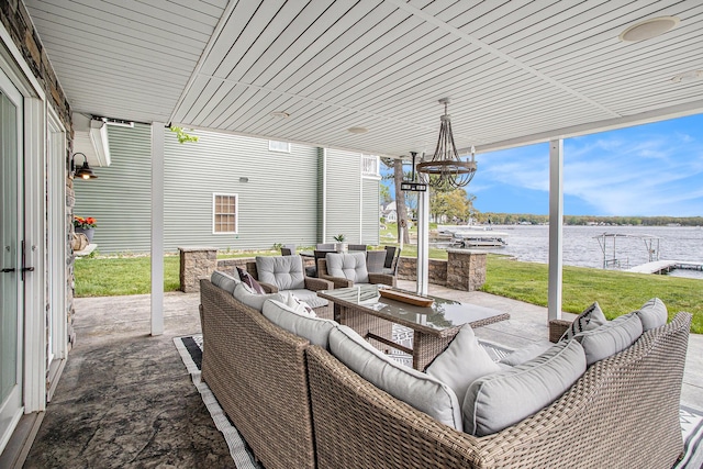 view of patio featuring outdoor lounge area and a water view