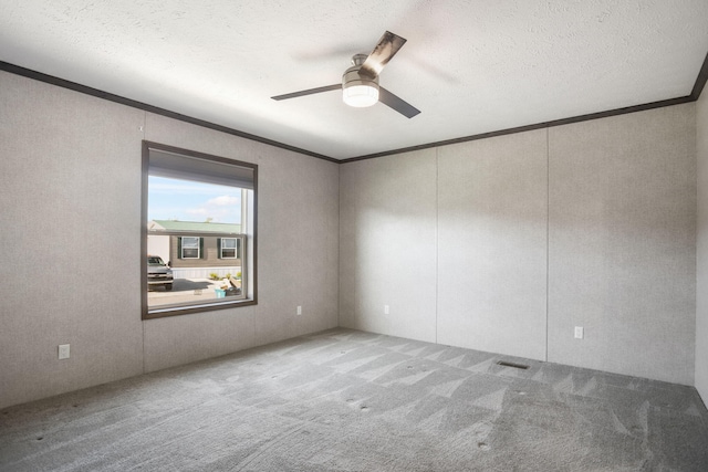 unfurnished room featuring crown molding, carpet floors, a ceiling fan, and a textured ceiling