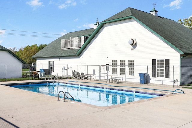 view of pool with fence and a patio