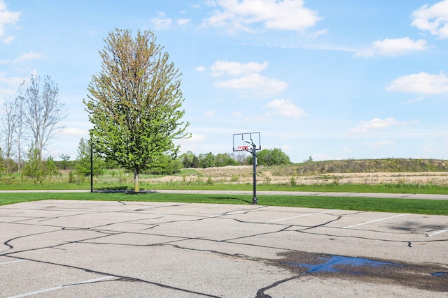 view of sport court with community basketball court and a yard