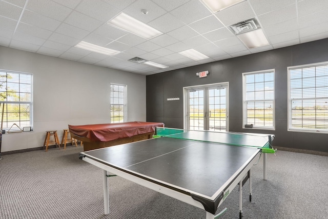 game room with carpet flooring, french doors, pool table, baseboards, and a drop ceiling