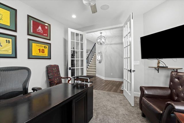 8353 Pier Point Ct, South Lyon, MI 48178 - home office with french doors, a chandelier, baseboards, carpet, and recessed lighting