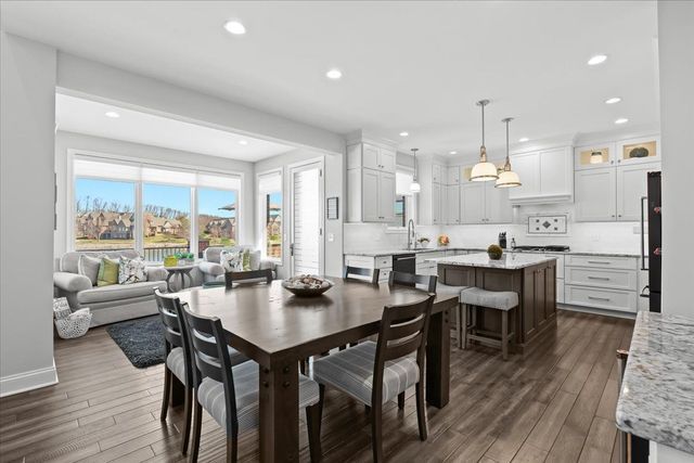8353 Pier Point Ct, South Lyon, MI 48178 - dining room with dark wood finished floors and recessed lighting