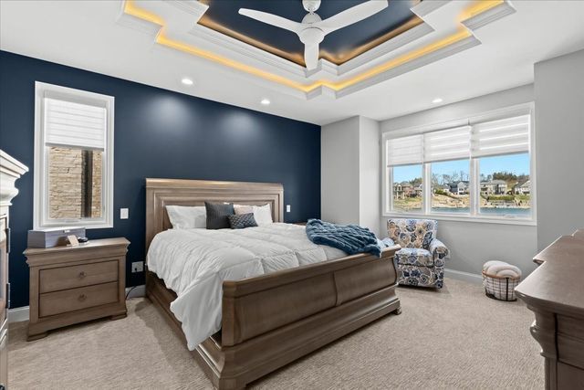 8353 Pier Point Ct, South Lyon, MI 48178 - bedroom with carpet, baseboards, recessed lighting, a raised ceiling, and a ceiling fan