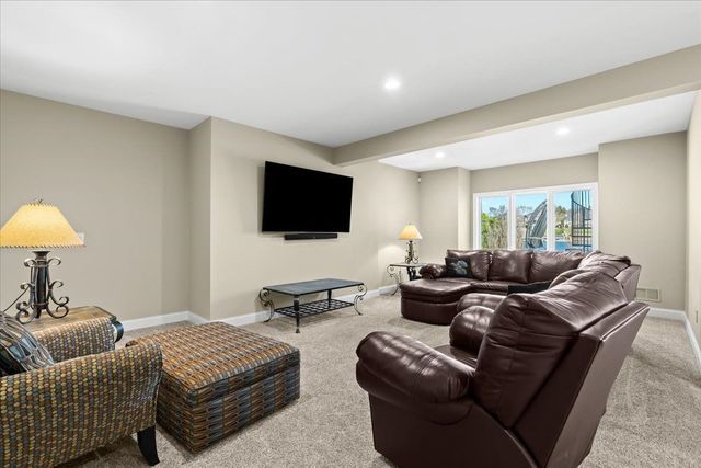 8353 Pier Point Ct, South Lyon, MI 48178 - living area featuring carpet, recessed lighting, and baseboards